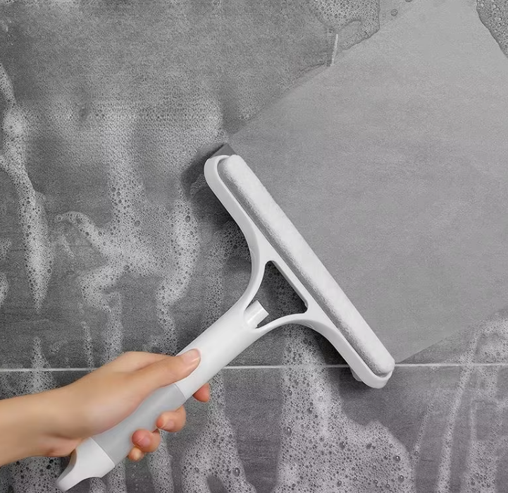 Buy one get one free! 💥 This 3-in-1 multi-functional glass mirror cleaning tool can scrub and scrape, and also comes with a spray bottle.